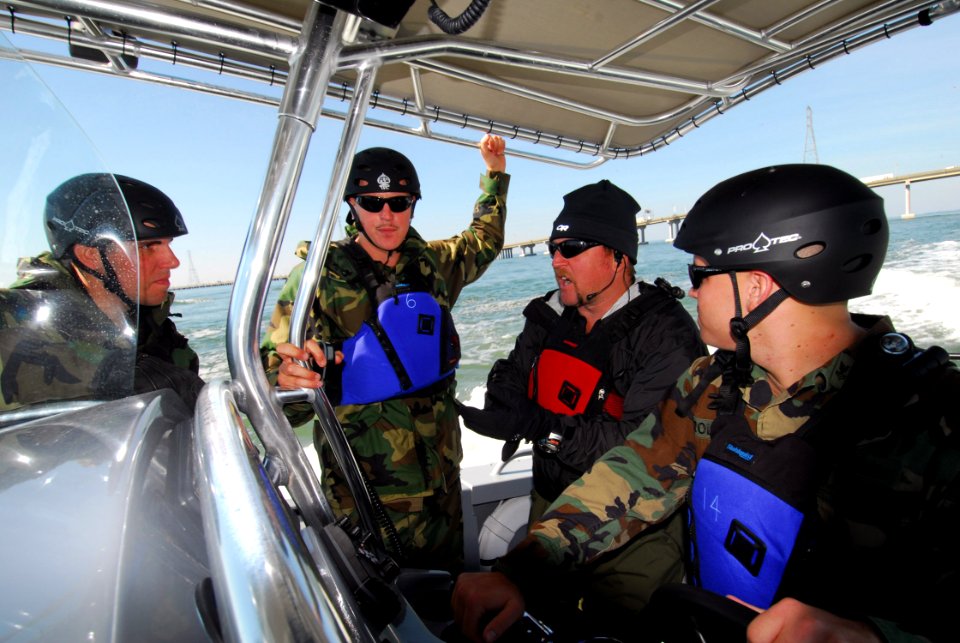 US Navy 071015-N-8907D-086 Eric Lynch an instructor for the Center for Security Forces Command, demonstrates proper high-speed boat maneuvering techniques during port security training off the coast of Virginia Beach