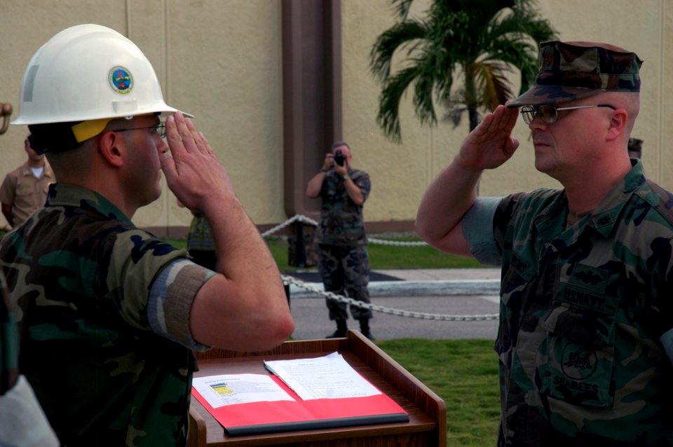 US Navy 071012-N-7367K-023 Lt. Cmdr. Michael Mihaly, left, the Guam detachment officer-in-charge for U.S. Naval Mobile Construction Battalion (NMCB) 1, accepts command over Camp Covington from Lt. Cmdr. Kemit Spears, the execut