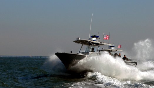 US Navy 071015-N-8907D-287 Sailors aboard high-speed security boats pursue mock targets while enforcing a 450-yard safety zone during port security training with the Center for Security Forces Command