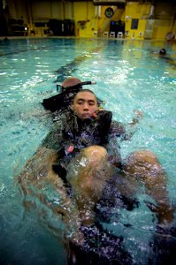 US Navy 071010-N-5319A-009 Aviation Warfare Systems Operator 3rd Class Tadashi Morishita is dragged during buddy towing drills during Rescue Swimmer School training at Naval Air Station Pensacola