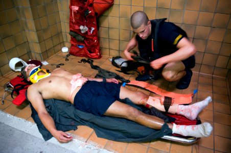 US Navy 071010-N-5319A-012 Rescue Swimmer School candidates conduct first aid training as part of their training at Naval Air Station Pensacola