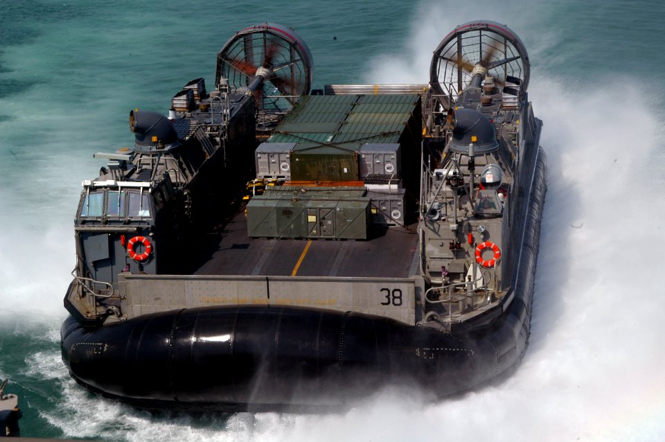US Navy 071012-N-7955L-009 A landing craft air cushion, attached to Assault Craft Unit (ACU) 4, brings supplies aboard amphibious assault ship USS Kearsarge (LHD 3)