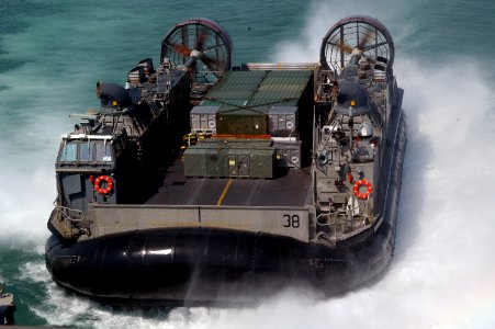 US Navy 071012-N-7955L-009 A landing craft air cushion, attached to Assault Craft Unit (ACU) 4, brings supplies aboard amphibious assault ship USS Kearsarge (LHD 3)