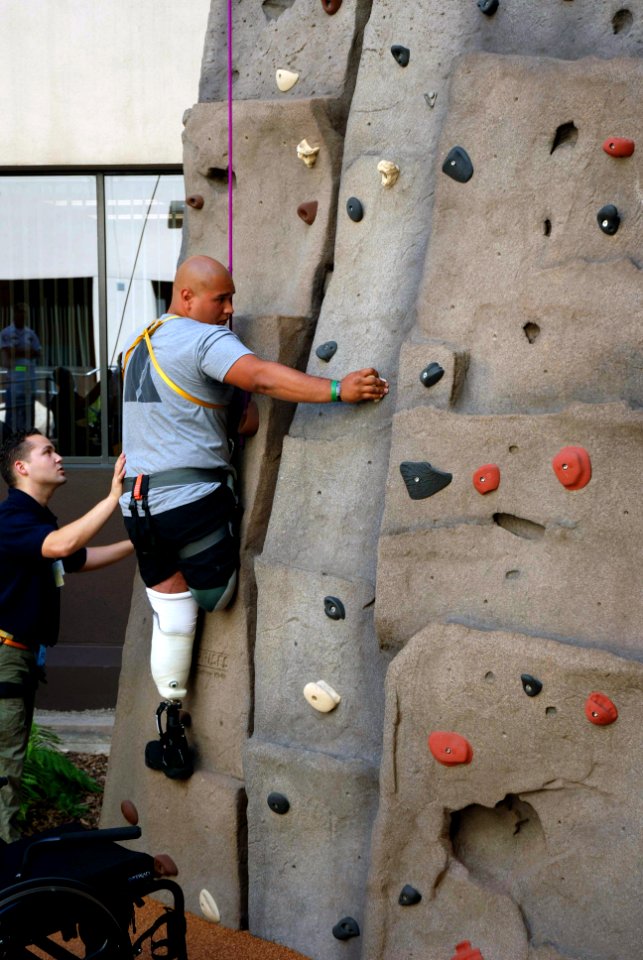 US Navy 071015-N-5086M-037 U.S. Spc. Saul Martinez, who has sustained injury during combat, climbs the new 30-foot rock-climbing wall in the Comprehensive Combat and Complex Casualty Care (C5) facility at Naval Medical Center S
