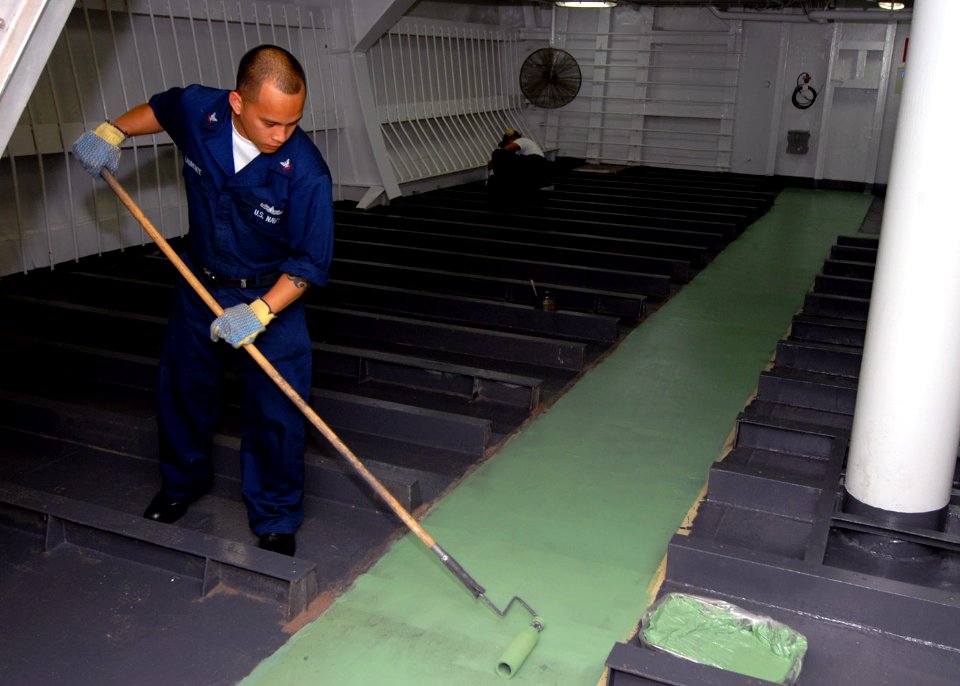 US Navy 071016-N-4399G-006 Culinary Specialist 3rd Class Archival S. Laurente applies primer in the dry food storage area aboard amphibious command ship USS Blue Ridge (LCC 19)