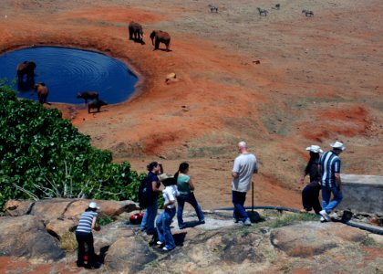 US Navy 071020-N-4014G-288 Sailors attached to the guided-missile destroyer USS Porter (DDG 78) watch African elephants drink from a watering hole while on safari in Mombasa