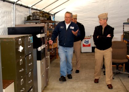 US Navy 071022-N-9860Y-003 Paul Brewer gives Capt. Gerral David, Naval Air Station (NAS) Whidbey Island commanding officer, a tour of the Navy Recycle Center at NAS Whidbey Island