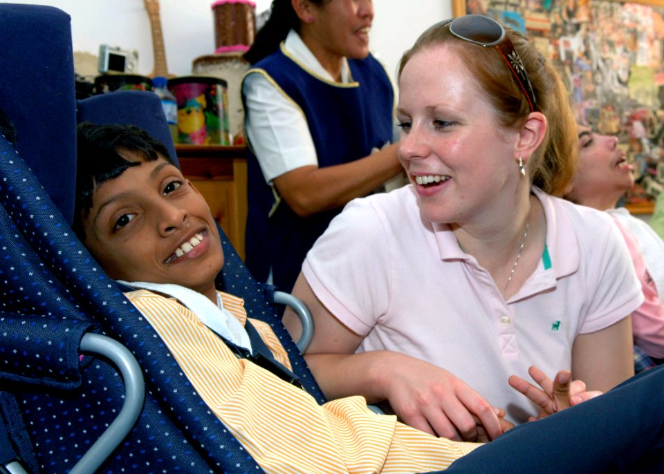 US Navy 071016-N-6524M-002 Hospital Corpsman 2nd Class Rita Rombaoa participates in a community relations project at the Dubai Center for Special Needs