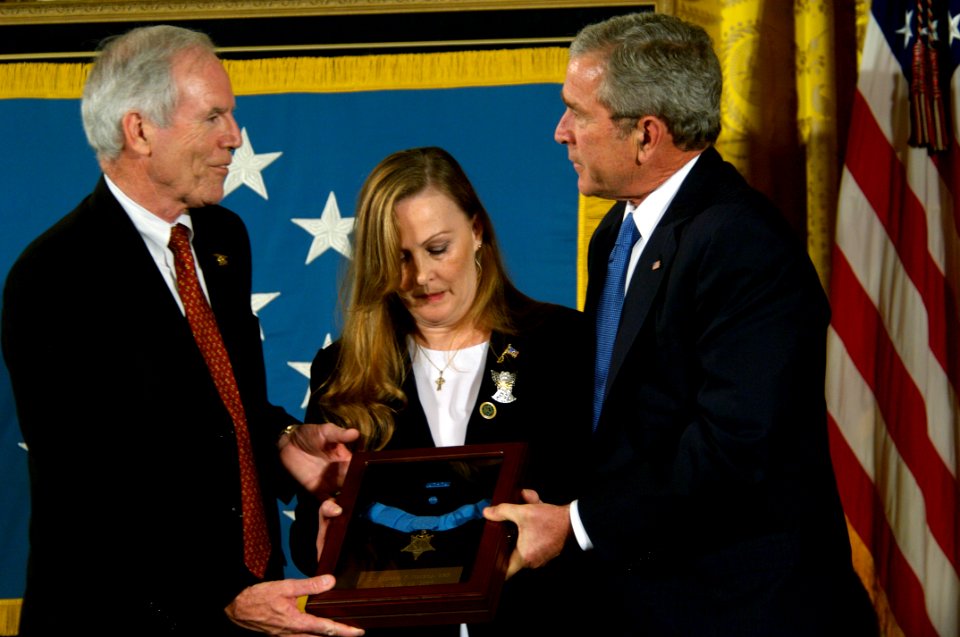 US Navy 071022-N-5319A-020 President George W. Bush presents the Medal of Honor to Daniel and Maureen Murphy, the parents of Navy SEAL Lt. Michael Murphy, during a ceremony at the White House