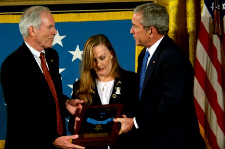 US Navy 071022-N-5319A-020 President George W. Bush presents the Medal of Honor to Daniel and Maureen Murphy, the parents of Navy SEAL Lt. Michael Murphy, during a ceremony at the White House