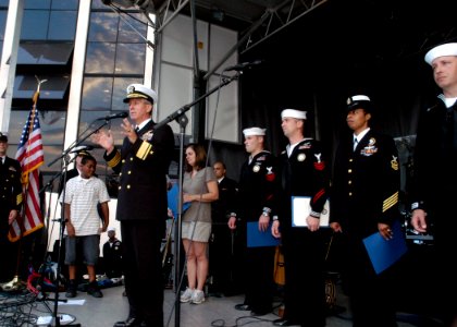 US Navy 071019-N-5208T-001 Commander, Naval Education and Training Command, Rear Adm. Gary Jones reenlists members attached to Naval Recruiting District Raleigh at the North Carolina State Fair
