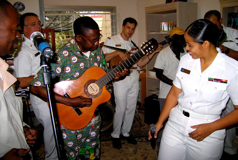 US Navy 071019-N-0000X-001 Musician 1st Class Luslaida Barbosa and the Commander, Naval Forces Europe - Commander, Sixth Fleet (CNE-C6F) rock band, Topside, play with local Congolese musicians