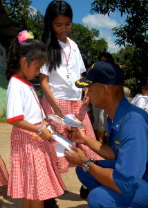 US Navy 071016-N-6710M-137 Cmdr. Todd A. Lewis, commanding officer of the USS Tortuga (LSD 46), interacts with the students of Gordon Heights Elementary School while conducting a community relations project in the Republic of P