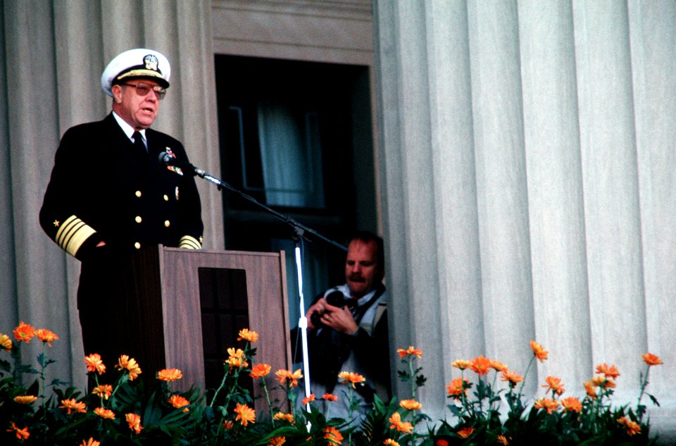 US Navy 071018-N-0000X-002 Navy file photo of Adm. William J. Crowe Jr., chairman of Joint Chiefs of Staff, standing on the portico of the National Archives Building as he addresses the crowd attending the dedication of the U.S