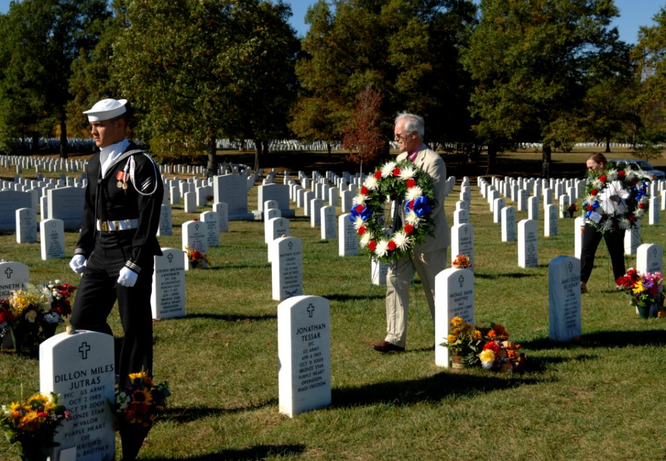 US Navy 071021-N-2653P-241 A member of the Navy Ceremonial Guard escorts Daniel and Maureen Murphy, the parents of Navy SEAL Lt. Michael Murphy, through Arlington National Cemetery