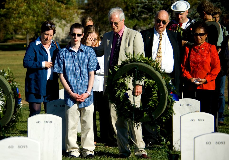 US Navy 071021-N-5319A-042 The family of Navy SEAL Lt. Michael Murphy visit the graves of service members killed by the same enemy forces as their son during a visit to Arlington National Cemetery