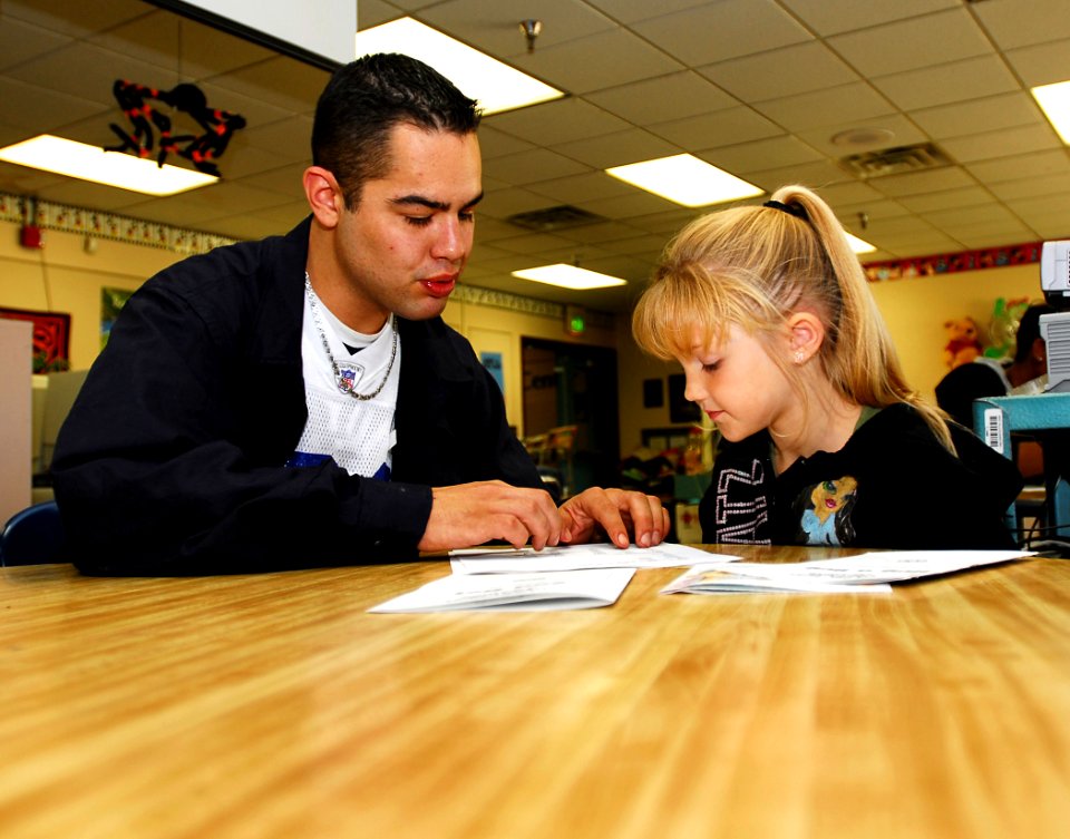 US Navy 071022-N-6538W-023 Machinist's Mate 3rd Class Joseph Herrera, tutors 1st graders at West Hills Elementary School