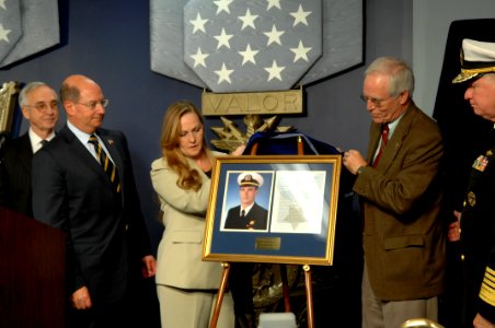 US Navy 071023-N-2653P-389 Daniel and Maureen Murphy, the parents of Navy SEAL Lt. Michael Murphy, unveil a photo of their son during a ceremony held at the Hall of Heroes inside the Pentagon