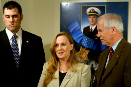 US Navy 071023-N-5319A-067 Navy SEAL Marcus Luttrell stands beside Daniel and Maureen Murphy, the parents of Navy SEAL Lt. Michael Murphy, as they are interviewed during a tour of the Pentagon