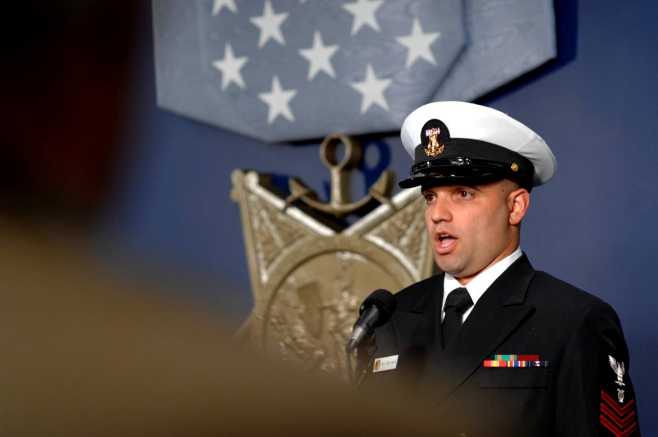 US Navy 071023-N-2653P-116 A Navy musician sings the national anthem during a ceremony recognizing the actions of Navy SEAL Lt. Michael Murphy held at the Hall of Heroes inside the Pentagon