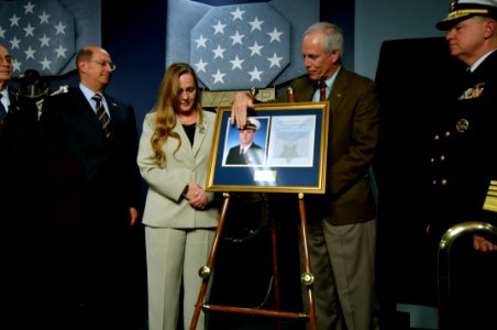 US Navy 071023-N-5319A-208 Daniel and Maureen Murphy, the parents of Navy SEAL Lt. Michael Murphy admire a photo of their son during a ceremony held at the Hall of Heroes inside the Pentagon