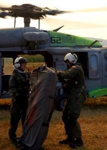 US Navy 071023-N-3069F-024 Chief Aviation Electronics Technician Rexford Sackett, right, and Aviation Warfare Systems Operator 3rd Class William Quadrino, assigned to Helicopter Sea Combat Squadron (HSC) 85, prepare to assemble