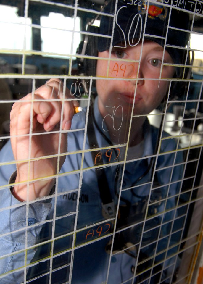 US Navy 071024-N-6710M-004 Operations Specialist Seaman Whitney R. Hudson tracks contacts using the status board in Pilothouse aboard the dock landing ship USS Tortuga (LSD 46) photo