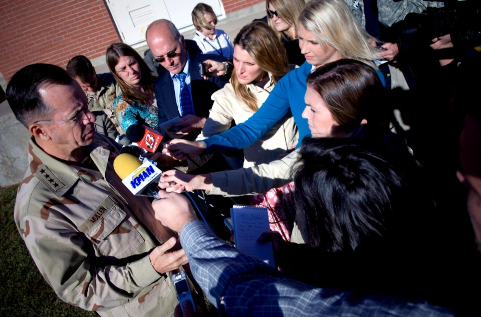 US Navy 071024-N-0696M-301 Chairman of the Joint Chiefs of Staff, U.S. Navy Adm. Mike Mullen answer questions during media availability after at a town hall meeting with soldiers stationed at Fort Riley, Kan