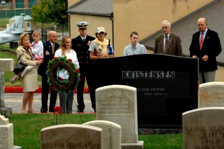 US Navy 071024-N-2653P-011 Family members of SEAL Lt. Michael Murphy join Rear Adm. Edward Kristensen and his wife as they visit the gravestone of SEAL Lt. Cmdr. Erik Samuel Kristensen at the U.S. Naval Academy