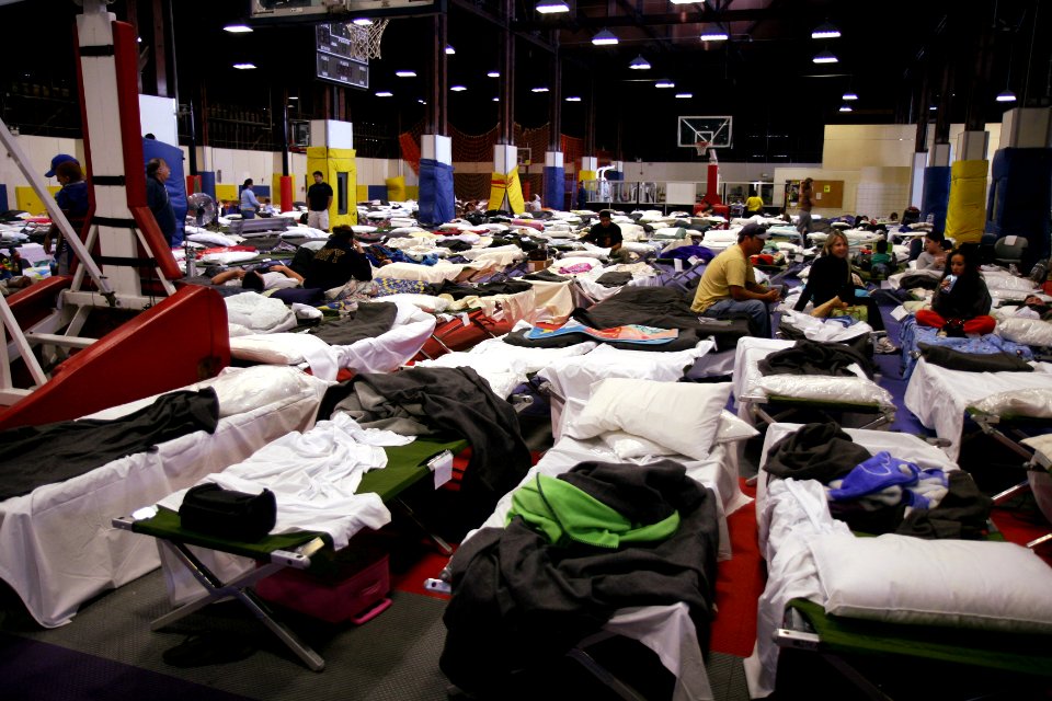 US Navy 071023-N-3659B-006 Evacuees from San Diego County take refuge in the Sports Warehouse Gym on board Naval Air Station North Island
