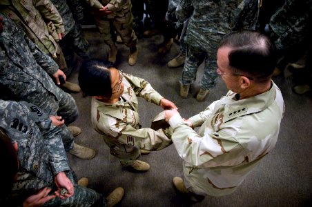 US Navy 071024-N-0696M-259 Chairman of the Joint Chiefs of Staff, U.S. Navy Adm. Mike Mullen greets service members at the conclusion of a town hall meeting at Fort Riley, Kan