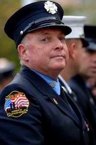 US Navy 071023-N-2653P-268 A New York City firefighter representing Engine 53, Ladder 43, attends the Medal of Honor Flag ceremony recognizing the actions of Navy SEAL Lt. Michael Murphy held at the United States Navy Memorial