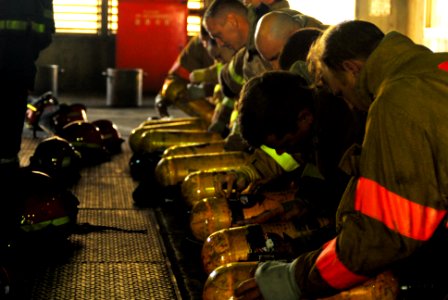 US Navy 071024-N-2638R-003 Sailors assigned to the submarine tender USS Frank Cable (AS 40), prepare their self-contained breathing apparatuses (SCBA) during an advanced shipboard fire fighting course at the Center for Naval En