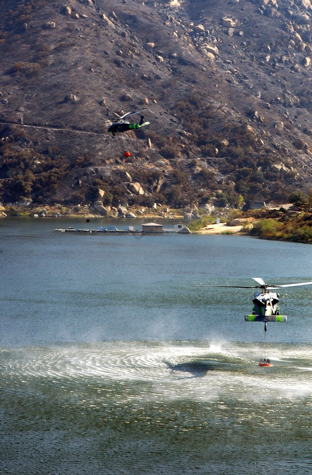 US Navy 071026-N-6597H-045 Two MH-60S Seahawks retrieve water from a lake near a wildfire in San Diego County