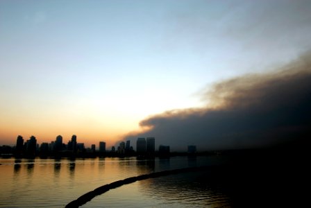 US Navy 071023-N-4776G-008 Smoke from the Harris Wildfires billow behind the San Diego skyline in the early morning