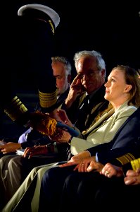 US Navy 071023-N-5319A-027 Chief of Naval Operations (CNO) Adm. Gary Roughead presents the folded Medal of Honor Flag to Daniel and Maureen Murphy, the parents of Navy SEAL Lt. Michael Murphy, during the special ceremony in hon