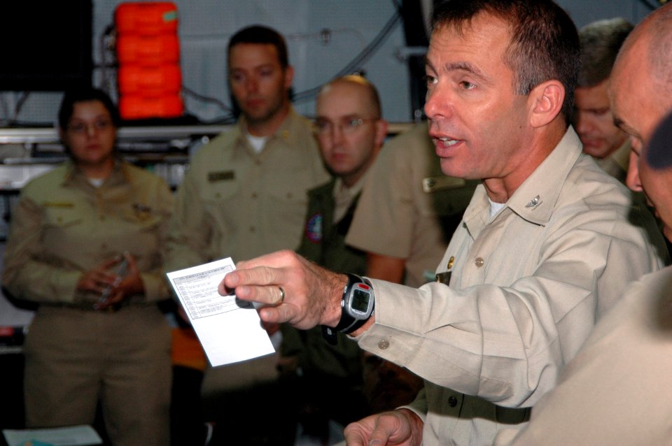 US Navy 071024-N-4005H-124 Capt. Terry B. Kraft, commanding officer of Nimitz-class aircraft carrier USS Ronald Reagan (CVN 76), directs members of the crisis response team on how to assist with the San Diego County wildfires