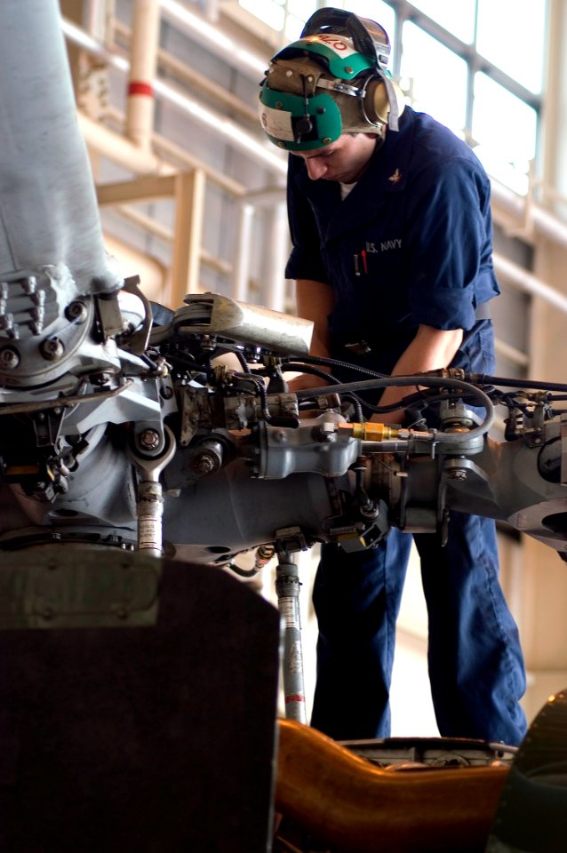 US Navy 071030-N-5253W-002 A Sailor assigned to the Warlords of Helicopter Anti-Submarine Squadron Light (HSL) 51, performs routine maintenance on one of the squadron's SH-60F Seahawk helicopters on board Naval Air Facility Ats