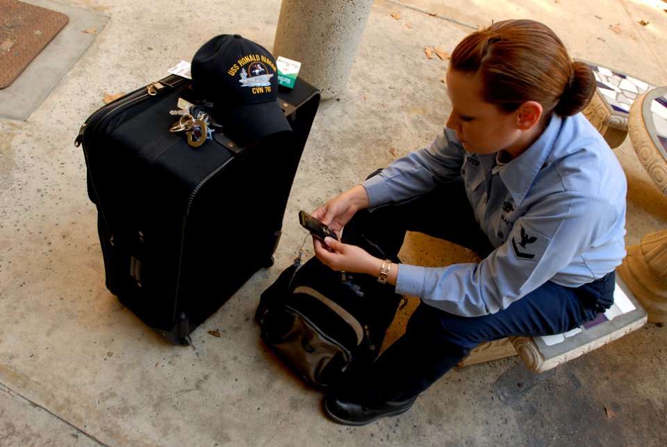 US Navy 071023-N-4776G-161 Aviation Ordnanceman 3rd Class Amanda Beaver, of St. Louis, moves her belongings from her barracks room at Naval Station North Island to USS Ronald Reagan (CVN 76) to give evacuees from San Diego Coun