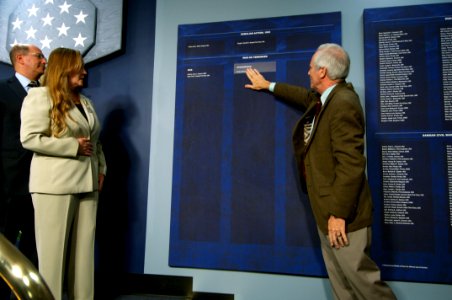 US Navy 071023-N-5319A-227 Daniel Murphy, father of Navy SEAL Lt. Michael Murphy, touches the wall inscription of his son's name after it is revealed during a ceremony held at the Hall of Heroes inside the Pentagon