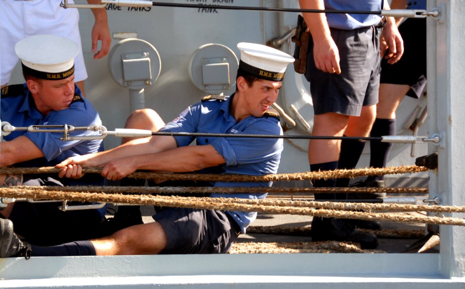 US Navy 071025-N-4965F-008 Sailors aboard British Royal Navy frigate HMS Monmouth (F235) perform line handling duties as the ship moors pierside Naval Station Pearl Harbor