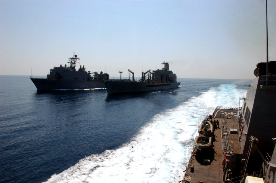 US Navy 071025-N-4014G-212 Guided-missile destroyer USS Porter (DDG 78) pulls away from Military Sealift Command fleet replenishment oilier USNS Leroy Grumman (T-AO 195) after an underway replenishment as Leroy Grumman