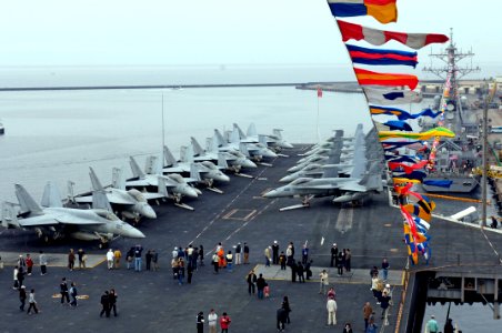 US Navy 071027-N-7883G-010 Visitors tour the flight deck of the USS Kitty Hawk (CV 63). More than 23,000 people visited the Navy's oldest aircraft carrier during a port visit photo