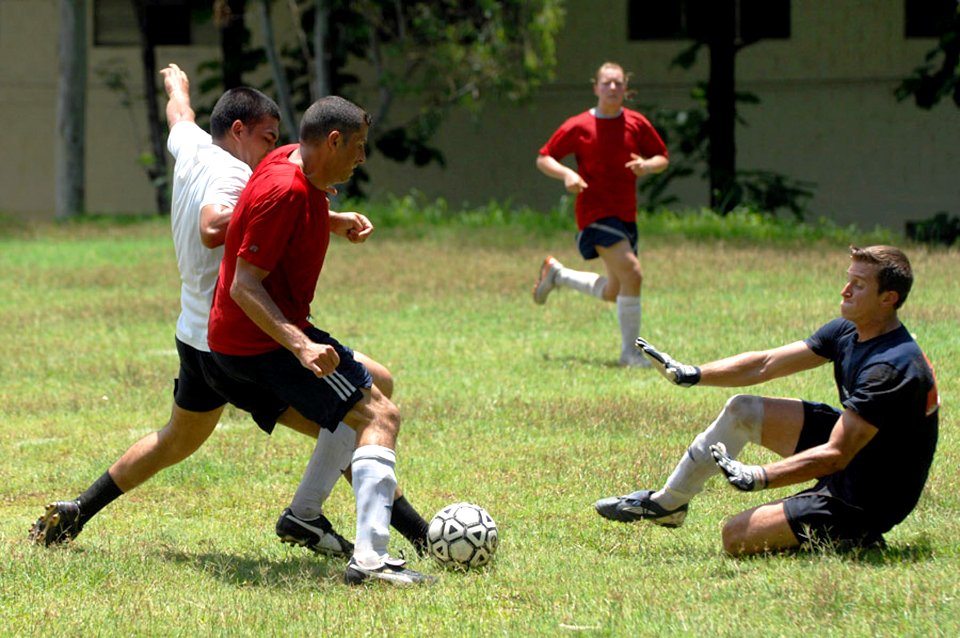 US Navy 090629-F-1333S-093 Fun Boss Jeremy Dieter, embarked aboard the Military Sealift Command hospital ship USNS Comfort (T-AH20), blocks a kick as Lt. David Goodrich, also from Comfort, attempts to regain possession of the b