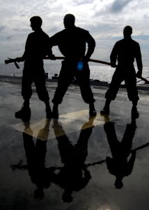 US Navy 090625-N-5538K-161 Sailors stand by with a charged hose during an emergency flight quarters fire drill on the flight deck of the amphibious transport dock ship USS Denver (LPD 9)