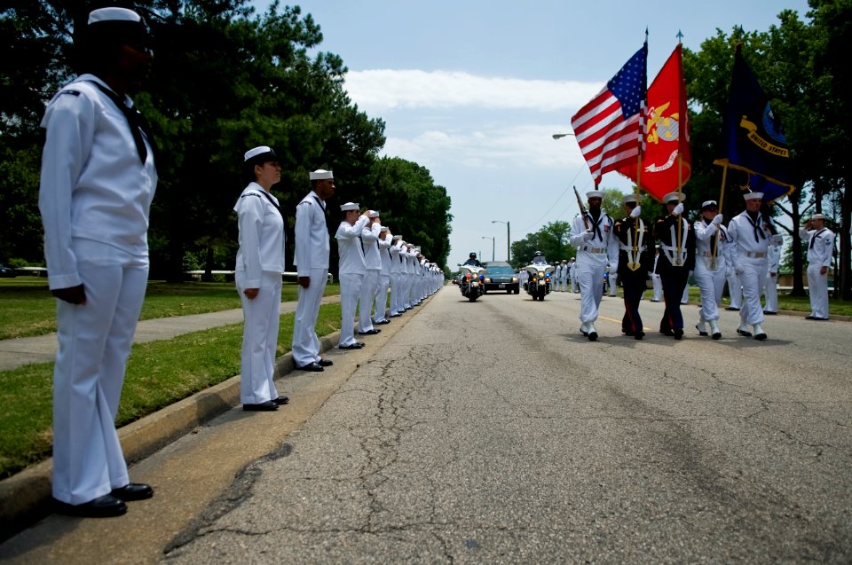 US Navy 090627-N-4154B-005 Sailors and Marines line the sides of Tomcat Boulevard at Oceana Naval Air Station during a memorial service for Command Master Chief Jeffrey Garber
