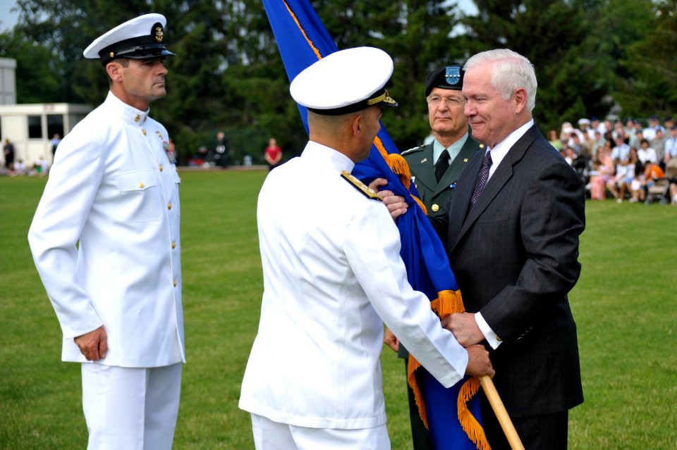 US Navy 090630-F-1256H-002 Navy Adm. James Stavridis, U.S. European Command commander, takes the USEUCOM guide-on from the Secretary of Defense Robert Gates, during a ceremony