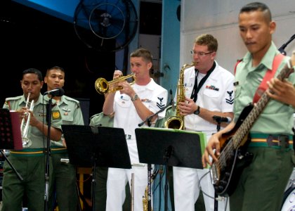 US Navy 090626-N-1722M-061 Musician 2nd Class Collin Reichow, center left, and Musician 2nd Class John Wylie, both assigned to the U.S. 7th Fleet Rock Band Orient Express, perform with the Malaysian Armed Forces KOMBO D' Tiger