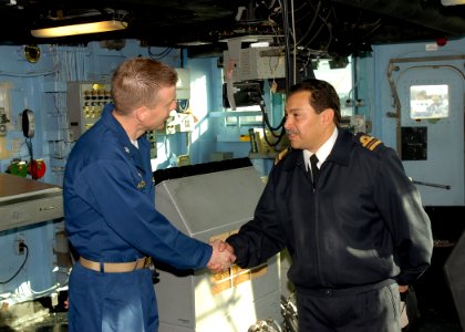 US Navy 090630-N-0924R-019 Cmdr. Daniel Blackburn, commanding officer of the amphibious dock landing ship USS Oak Hill (LSD 51), left, and Navy of the Argentine Republic Lt. Cmdr. Marcelo Paredes shake hands at the end of a tou