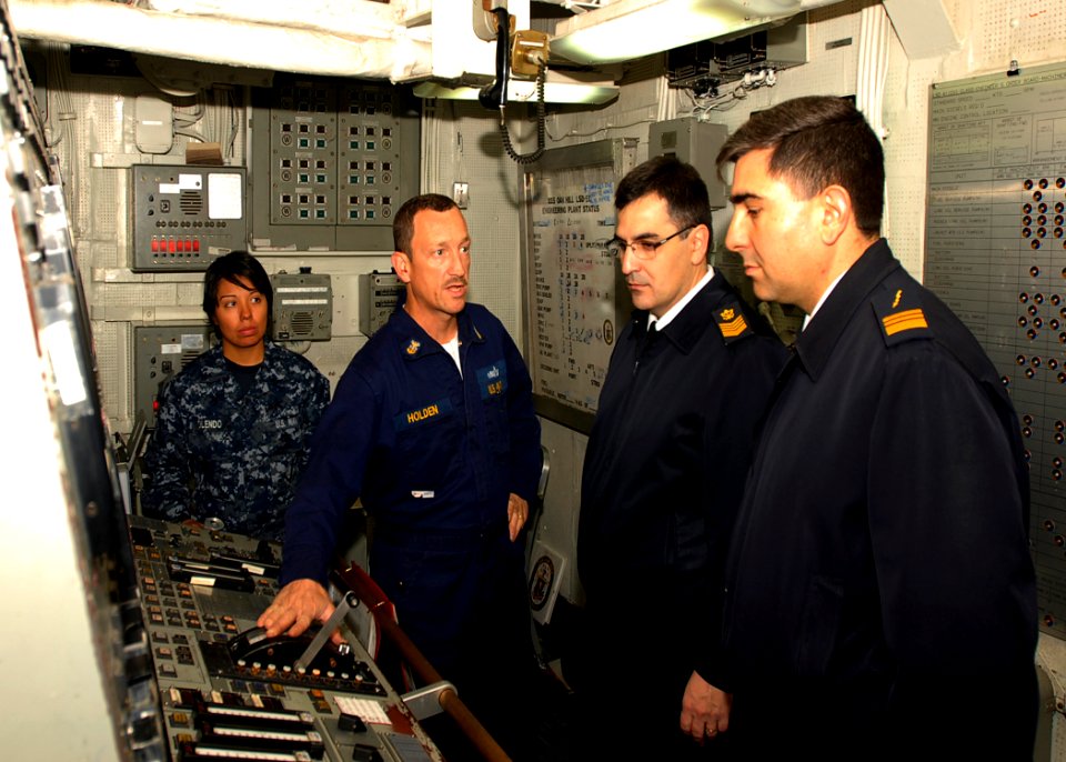 US Navy 090629-N-0924R-005 Master Chief Engineman Patrick Holden explains the engineering console of the amphibious dock landing ship Oak Hill (LSD 51) to Navy of the Argentine Republic chief petty officers
